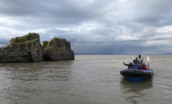 Rib boats approaching Flat Holm Island.